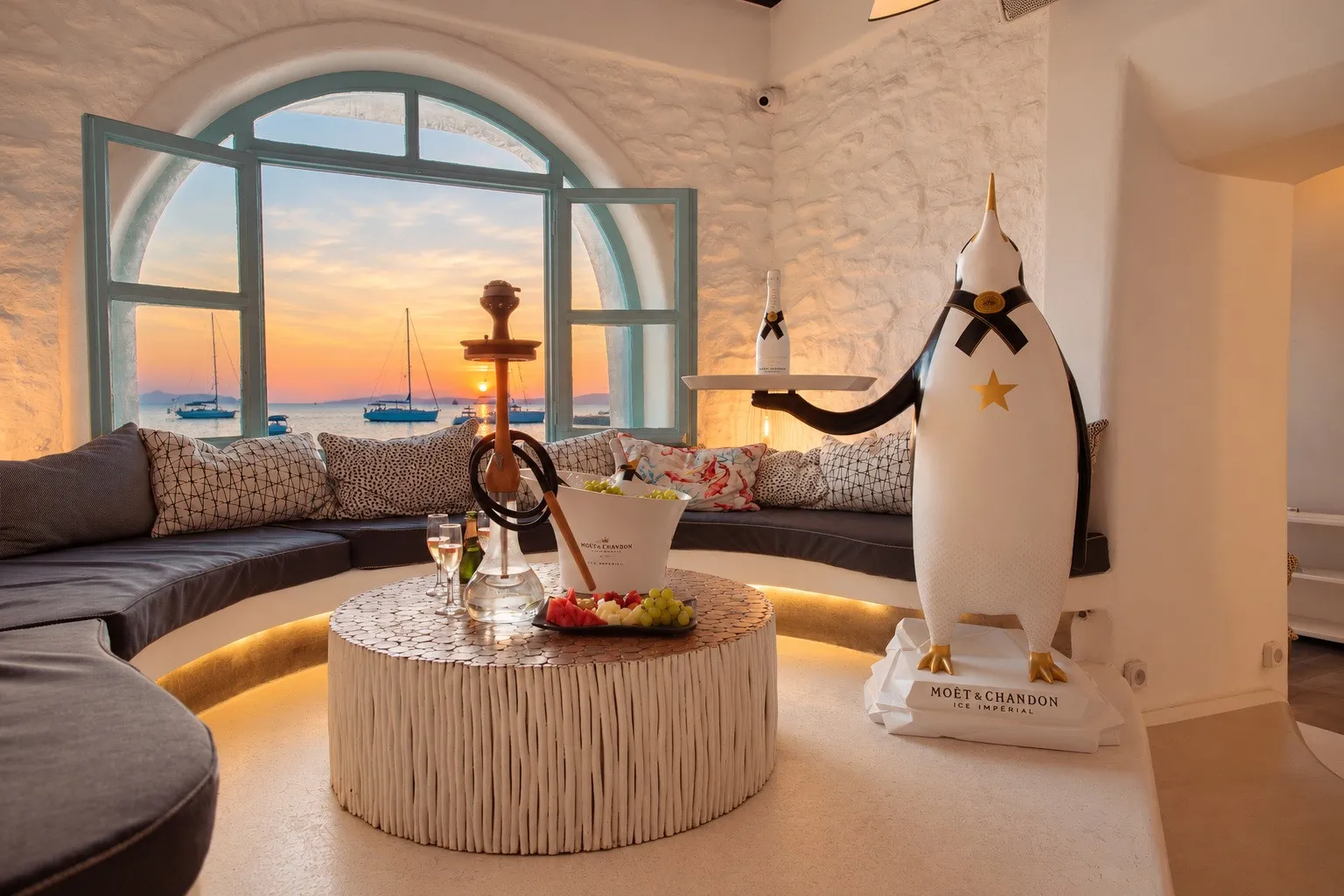 A shisha set up on a low table in the alcove at BAO'S, the arched window open to the sea