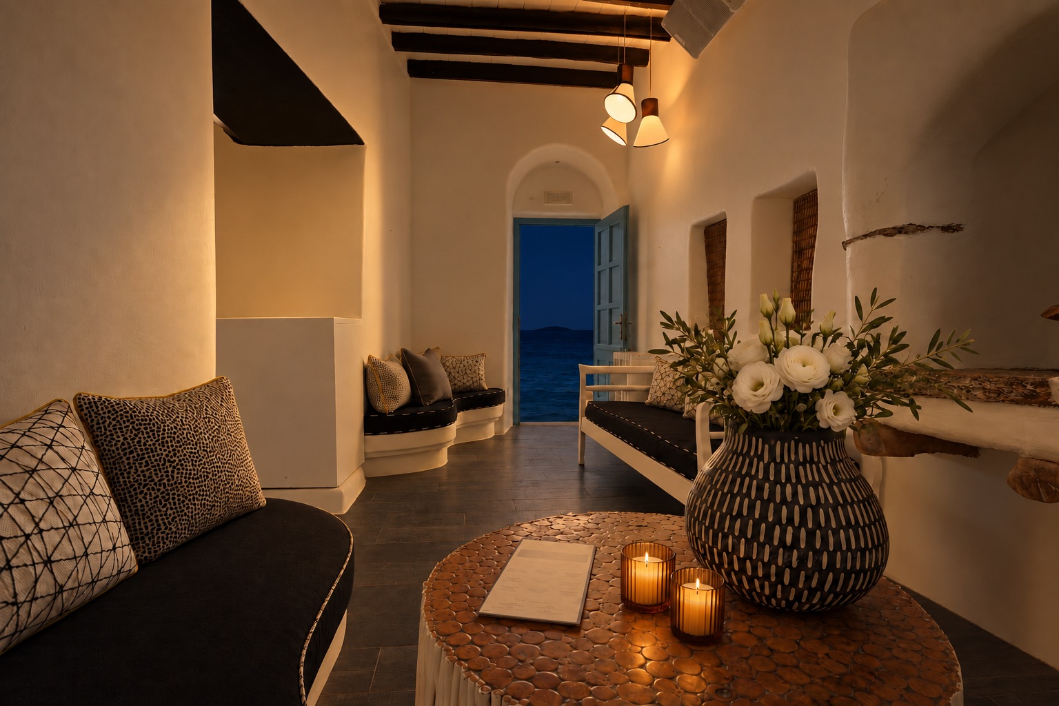 The Room at night, candlelit, the door open onto the dark water of Little Venice